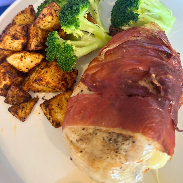 Air Fryer Prosciutto Wrapped Chicken on plate and served