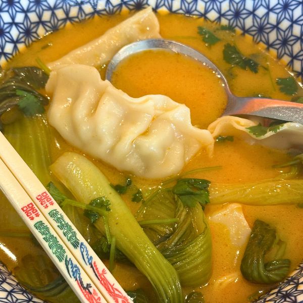 red curry dumpling soup served red curry dumpling soup served in bowl
