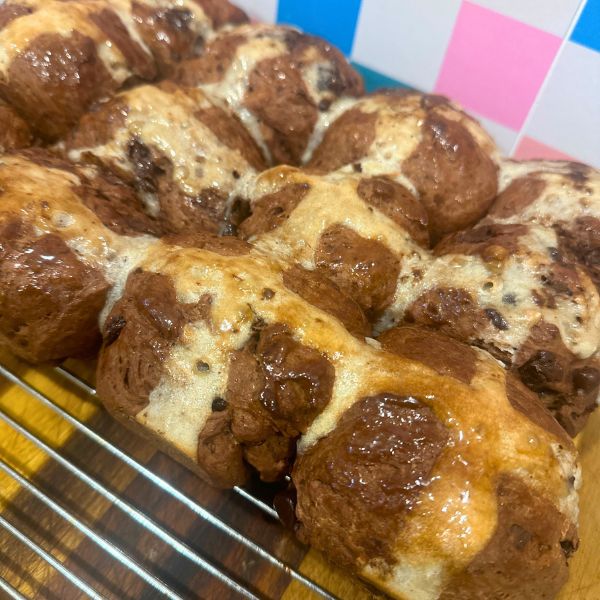 Choc Chip Hot Cross Buns on tray Choc Chip Hot Cross Buns served on cooling tray