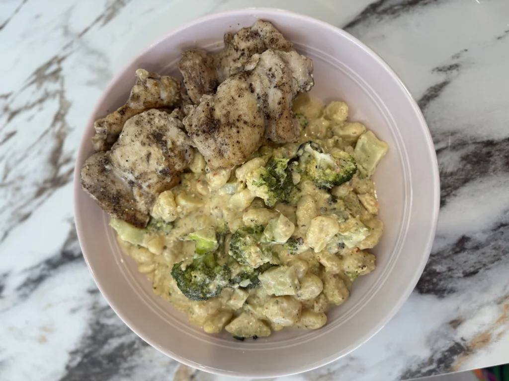 Creamy chicken gnocchi with broccoli and golden chicken thighs