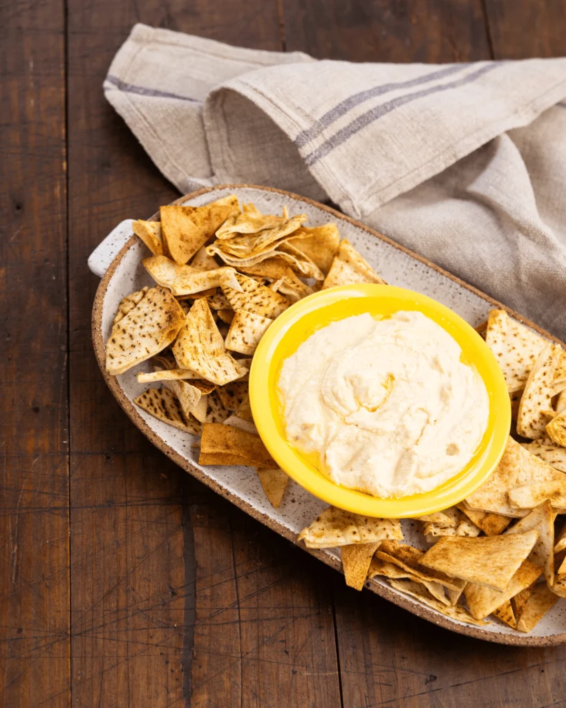 Creamy hummus served with crispy Lebanese bread chips
